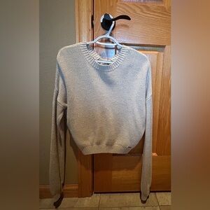 Hollister tan, crop sweater, with open back and tie. Size Small.